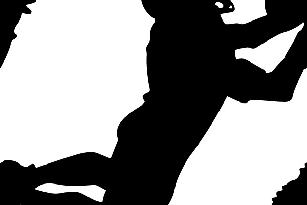 Silhouette of a Football Player Catching the Ball